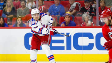 Oct 28, 2016; Raleigh, NC, USA; New York Rangers forward Mika Zibanejad (93) gets off a shot during the game against the Carolina Hurricanes at PNC Arena. The Carolina Hurricanes defeated the New York Rangers 3-2. Mandatory Credit: James Guillory-USA TODAY Sports