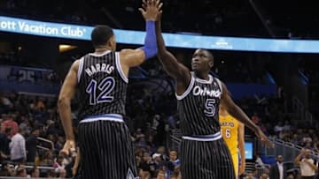 Jan 24, 2014; Orlando, FL, USA; Orlando Magic small forward Tobias Harris (12) and shooting guard Victor Oladipo (5) high five against the Los Angeles Lakers during the second half at Amway Center. Orlando Magic won 114-105. Mandatory Credit: Kim Klement-USA TODAY Sports