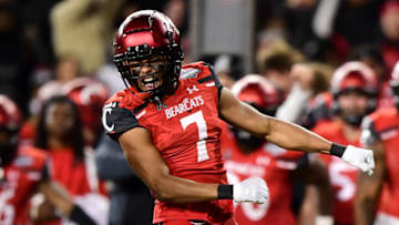 CINCINNATI, OHIO - DECEMBER 04: Coby Bryant #7 of the Cincinnati Bearcats celebrates an interception during the second half of the 2021 American Conference Championship against the Houston Cougars at Nippert Stadium on December 04, 2021 in Cincinnati, Ohio. (Photo by Emilee Chinn/Getty Images)