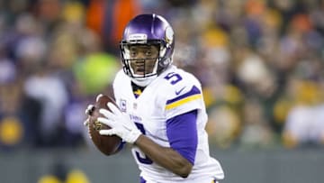 Jan 3, 2016; Green Bay, WI, USA; Minnesota Vikings quarterback Teddy Bridgewater (5) looks to pass during the first quarter against the Green Bay Packers at Lambeau Field. Mandatory Credit: Jeff Hanisch-USA TODAY Sports