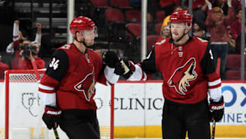 GLENDALE, ARIZONA - OCTOBER 17: Carl Soderberg #34 of the Arizona Coyotes is congratulated by teammate Christian Fischer #36 after scoring a goal against the Nashville Predators during the third period at Gila River Arena on October 17, 2019 in Glendale, Arizona. (Photo by Norm Hall/NHLI via Getty Images)