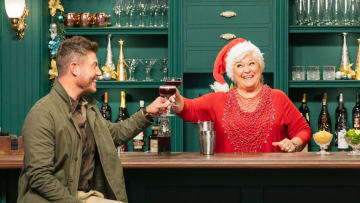 Host Jesse Palmer and Judge Nancy Fuller, as seen on Holiday Baking Championship, Season 8. Photo courtesy Food Network
