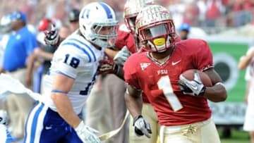 Oct 27, 2012; Tallahassee, Florida, USA; Florida State Seminoles defensive back Tyler Hunter (1) runs a punt return back for a touchdown during the first half of the game against the Duke Blue Devils at Doak Campbell Stadium. Mandatory Credit: Melina Vastola-USA TODAY Sports