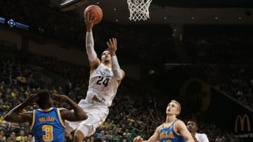 Dec 28, 2016; Eugene, OR, USA; Oregon Ducks forward Dillon Brooks (24) shoots the ball as UCLA Bruins guard Aaron Holiday (3) and guard Isaac Hamilton (10) watch in the second half at Matthew Knight Arena. Mandatory Credit: Scott Olmos-USA TODAY Sports