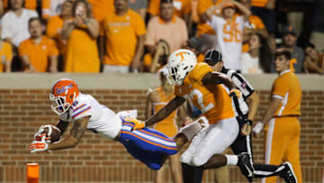 KNOXVILLE, TN - SEPTEMBER 22: Freddie Swain #16 of the Florida Gators dives for a touchdown past Defensive back Micah Abernathy #22 of the Tennessee Volunteers during the second quarter of the game between the Florida Gators and Tennessee Volunteers at Neyland Stadium on September 22, 2018 in Knoxville, Tennessee. (Photo by Donald Page/Getty Images)