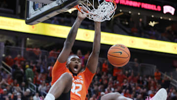 LAS VEGAS, NEVADA - NOVEMBER 18: Dain Dainja #42 of the Illinois Fighting Illini dunks against the UCLA Bruins in the first half of their game during the Continental Tire Main Event basketball tournament at T-Mobile Arena on November 18, 2022 in Las Vegas, Nevada. (Photo by Ethan Miller/Getty Images)