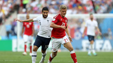 MOSCOW, RUSSIA - JUNE 26: Andreas Cornelius of Denmark is challenged by Nabil Fekir of France during the 2018 FIFA World Cup Russia group C match between Denmark and France at Luzhniki Stadium on June 26, 2018 in Moscow, Russia. (Photo by Clive Rose/Getty Images)
