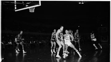 Basketball... Los Angeles Lakers versus St. Louis Hawks, 12 December 1960. Rudy La Russo;Jerry West;Rod Hundley;Elgin Baylor. (Sleeve reads: SP-12950).;Caption slip reads: 'Photographer: Jensen. Date: 1960-12-12. Assignment: L.A vs Hawks. Photographer: Jensen. 102: Selvy. 103: La Russo being fouled. 15: 34 H;35 LA 16: West being fouled by 17 H. 19: Hundley scores. 20: Baylor scores. 21: 34 H fouls West #44'.;Supplementary material reads: '1960-1961 St. Louis Hawks player roster: No. 11: Ferrari, Al...;No. 14: Foust, Larry...;No. 17: Green, Sihugo...;No. 16: Hagan, Cliff...;No. 19: La Cour, Fred...;No. 34: Lovellette, Clyde...;No. 15: McCarthy, John...;No. 9: Pettit, Bob...;No. 25: Piontek, Dave...;No. 21: Sauldsberry, W...;No. 32: Wilkins, Len...;Coach: Paul Seymour'.. (Photo by Los Angeles Examiner/USC Libraries/Corbis via Getty Images)