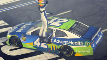 CHARLOTTE, NORTH CAROLINA - MAY 18: Kyle Larson, driver of the #42 Advent Health Chevrolet, celebrates winning the Monster Energy NASCAR Cup Series All-Star Race at Charlotte Motor Speedway on May 18, 2019 in Charlotte, North Carolina. (Photo by Jared C. Tilton/Getty Images)