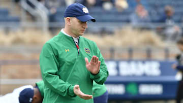 Apr 21, 2018; Notre Dame, IN, USA; Notre Dame Fighting Irish defensive coordinator Clark Lea watches warmups before the Blue-Gold Game at Notre Dame Stadium. Mandatory Credit: Matt Cashore-USA TODAY Sports