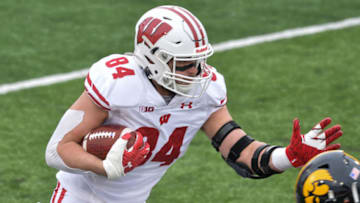 Dec 12, 2020; Iowa City, Iowa, USA; Wisconsin Badgers tight end Jake Ferguson (84) runs the ball after a reception during the first quarter against the Iowa Hawkeyes at Kinnick Stadium. Mandatory Credit: Jeffrey Becker-USA TODAY Sports