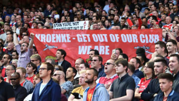 Arsenal fans hold up a banner against Arsenal's majority owner Stan Kroenke during the English Premier League football match between Arsenal and Everton at the Emirates Stadium in London on May 21, 2017. / AFP PHOTO / Justin TALLIS / RESTRICTED TO EDITORIAL USE. No use with unauthorized audio, video, data, fixture lists, club/league logos or 'live' services. Online in-match use limited to 75 images, no video emulation. No use in betting, games or single club/league/player publications. / (Photo credit should read JUSTIN TALLIS/AFP/Getty Images)