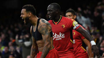 Watford's Norwegian striker Joshua King (L) celebrates scoring his team's third goal during the English Premier League football match between Everton and Watford at Goodison Park in Liverpool, north west England on October 23, 2021. - RESTRICTED TO EDITORIAL USE. No use with unauthorized audio, video, data, fixture lists, club/league logos or 'live' services. Online in-match use limited to 120 images. An additional 40 images may be used in extra time. No video emulation. Social media in-match use limited to 120 images. An additional 40 images may be used in extra time. No use in betting publications, games or single club/league/player publications. (Photo by Paul ELLIS / AFP) / RESTRICTED TO EDITORIAL USE. No use with unauthorized audio, video, data, fixture lists, club/league logos or 'live' services. Online in-match use limited to 120 images. An additional 40 images may be used in extra time. No video emulation. Social media in-match use limited to 120 images. An additional 40 images may be used in extra time. No use in betting publications, games or single club/league/player publications. / RESTRICTED TO EDITORIAL USE. No use with unauthorized audio, video, data, fixture lists, club/league logos or 'live' services. Online in-match use limited to 120 images. An additional 40 images may be used in extra time. No video emulation. Social media in-match use limited to 120 images. An additional 40 images may be used in extra time. No use in betting publications, games or single club/league/player publications. (Photo by PAUL ELLIS/AFP via Getty Images)