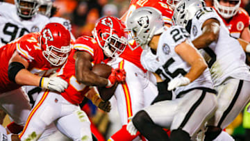 KANSAS CITY, MO - DECEMBER 01: Darwin Thompson #34 of the Kansas City Chiefs runs for a 4-yard touchdown in the fourth quarter while being pushed by Andrew Wylie #77 of the Kansas City Chiefs against the Oakland Raiders at Arrowhead Stadium on December 1, 2019 in Kansas City, Missouri. (Photo by David Eulitt/Getty Images)