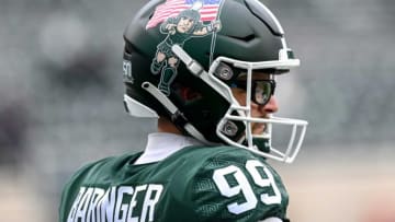 Sporting a helmet featuring Sparty carrying a flag, Michigan State's Bryce Baringer looks on before the football game against Rutgers on Saturday, Nov. 12, 2022, in East Lansing.221112 Msu Rutgers Fb 025a