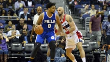 Oct 6, 2015; Washington, DC, USA; Philadelphia 76ers center Jahlil Okafor (8) dribbles asWashington Wizards center Marcin Gortat (13) defends during the first quarter at Verizon Center. Mandatory Credit: Tommy Gilligan-USA TODAY Sports