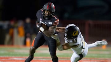 SALT LAKE CITY, UT - OCTOBER 26 : Devonta'e Henry-Cole #7 of the Utah Utes breaks a tackle by Evan Weaver #89 of the California Golden Bears during their game at Rice-Eccles Stadium on October 26, 2019 in Salt Lake City, Utah. (Photo by Chris Gardner/Getty Images)