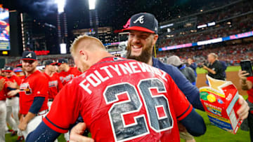 ATLANTA, GA - SEP 20: Dallas Keuchel #60 of the Atlanta Braves dunks Mike Foltynewicz #26 of the Atlanta Braves with milk at the conclusion of an MLB game against the San Francisco Giants in which they clinched the N.L. East at SunTrust Park on September 20, 2019 in Atlanta, Georgia. (Photo by Todd Kirkland/Getty Images)