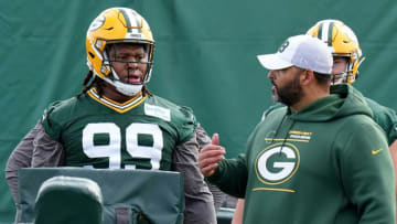 Defensive line coach Jerry Montgomery speaks with Jonathan Ford (99) during Green Bay Packers rookie camp Friday, May 6, 2022 in Green Bay, Wis.Packers07 34