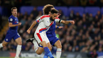 LONDON, ENGLAND - NOVEMBER 04: Andros Townsend of Crystal Palace scores his team's first goal under pressure from David Luiz of Chelsea during the Premier League match between Chelsea FC and Crystal Palace at Stamford Bridge on November 4, 2018 in London, United Kingdom. (Photo by Richard Heathcote/Getty Images)