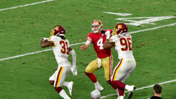 Dec 13, 2020; Glendale, Arizona, USA; Washington Football Team strong safety Kamren Curl (31) returns an interception as quarterback Steven Montez (6) blocks San Francisco 49ers quarterback Nick Mullens (4) during the second half at State Farm Stadium. Mandatory Credit: Matt Kartozian-USA TODAY Sports