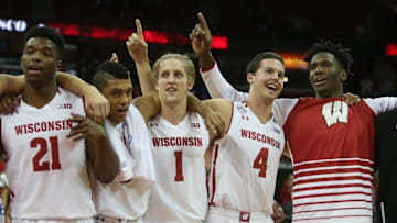 Nov 11, 2016; Madison, WI, USA; Members of the Wisconsin Badgers basketball team celebrate their win against the Central Arkansas Bears by singing the school song "Varsity" at the Kohl Center. Wisconsin defeated Central Arkansas 79-47. Mandatory Credit: Mary Langenfeld-USA TODAY Sports