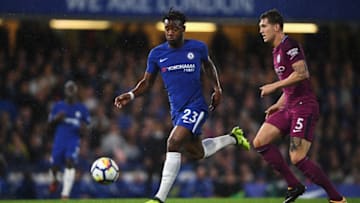 LONDON, ENGLAND - SEPTEMBER 30: Michy Batshuayi of Chelsea takes the ball away from John Stones of Manchester City during the Premier League match between Chelsea and Manchester City at Stamford Bridge on September 30, 2017 in London, England. (Photo by Mike Hewitt/Getty Images)