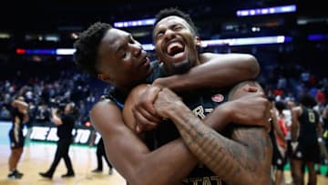 NASHVILLE, TN - MARCH 18: Mfiondu Kabengele #25 of the Florida State Seminoles celebrates with Braian Angola #11 after defeating the Xavier Musketeers in the second round of the 2018 Men's NCAA Basketball Tournament at Bridgestone Arena on March 18, 2018 in Nashville, Tennessee. (Photo by Andy Lyons/Getty Images)