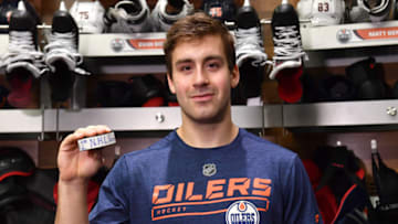 EDMONTON, AB - OCTOBER 25: Evan Bouchard #75 of the Edmonton Oilers poses after scoring his first NHL goal following the game against the Washington Capitals on October 25, 2018 at Rogers Place in Edmonton, Alberta, Canada. (Photo by Andy Devlin/NHLI via Getty Images)