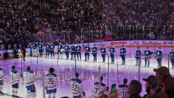 Nov 19, 2022; Toronto, Ontario, CAN; Toronto Maple Leafs and Buffalo Sabres raise their sticks during a pre-game tribute to NHL efforts to fight cancer at Scotiabank Arena. Mandatory Credit: Dan Hamilton-USA TODAY Sports