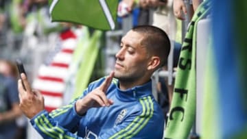 May 31, 2015; Seattle, WA, USA; Seattle Sounders FC forward Clint Dempsey (2) poses for a selfie with a fan following a 2-1 victory against the New York Red Bulls during the second half at CenturyLink Field. Mandatory Credit: Joe Nicholson-USA TODAY Sports