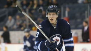 Nov 13, 2016; Winnipeg, Manitoba, CAN; Winnipeg Jets right wing Patrik Laine (29) plays with the puck prior to the game between the Los Angeles Kings and the Winnipeg Jets at MTS Centre. Mandatory Credit: Bruce Fedyck-USA TODAY Sports