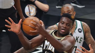 ATLANTA, GEORGIA - JUNE 29: Clint Capela #15 of the Atlanta Hawks grabs a rebound against P.J. Tucker #17 of the Milwaukee Bucks during the first half in Game Four of the Eastern Conference Finals at State Farm Arena on June 29, 2021 in Atlanta, Georgia. NOTE TO USER: User expressly acknowledges and agrees that, by downloading and or using this photograph, User is consenting to the terms and conditions of the Getty Images License Agreement. (Photo by Kevin C. Cox/Getty Images)