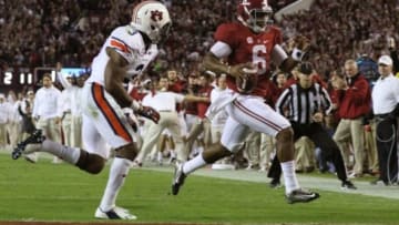 Nov 29, 2014; Tuscaloosa, AL, USA; Alabama Crimson Tide quarterback Blake Sims (6) scores on a fourth quarter touchdown run past Auburn Tigers defensive back Jonathan Jones (3) at Bryant-Denny Stadium. Mandatory Credit: Marvin Gentry-USA TODAY Sports