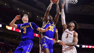 LOS ANGELES, CA - NOVEMBER 12: Baylor Scheierman #3 looks on as Douglas Wilson #35 of the South Dakota State Jackrabbits goes to the hoop against Elijah Weaver #3 of the USC Trojans in the first half at Galen Center on November 12, 2019 in Los Angeles, California. (Photo by John McCoy/Getty Images)