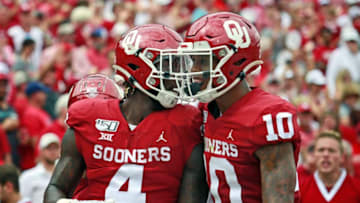 NORMAN, OK - SEPTEMBER 28: Running back Trey Sermon #4 and wide receiver Theo Wease #10 of the Oklahoma Sooners celebrate a touchdown against the Texas Tech Red Raiders at Gaylord Family Oklahoma Memorial Stadium on September 28, 2019 in Norman, Oklahoma. The Sooners defeated the Red Raiders 55-16. (Photo by Brett Deering/Getty Images)