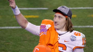 CHARLOTTE, NORTH CAROLINA - DECEMBER 19: Quarterback Trevor Lawrence #16 of the Clemson Tigers acknowledges fans as he walks off the field after defeating the Notre Dame Fighting Irish 34-10 in the ACC Championship game at Bank of America Stadium on December 19, 2020 in Charlotte, North Carolina. (Photo by Jared C. Tilton/Getty Images)