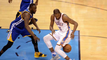 May 28, 2016; Oklahoma City, OK, USA; Oklahoma City Thunder forward Kevin Durant (35) loses control of the ball while guarded by Golden State Warriors forward Draymond Green (23) during the fourth quarter in game six of the Western conference finals of the NBA Playoffs at Chesapeake Energy Arena. Mandatory Credit: Mark D. Smith-USA TODAY Sports