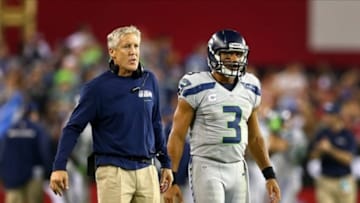 Oct 17, 2013; Phoenix, AZ, USA; Seattle Seahawks quarterback Russell Wilson (right) with head coach Pete Carroll in the second half against the Arizona Cardinals at University of Phoenix Stadium. Mandatory Credit: Mark J. Rebilas-USA TODAY Sports