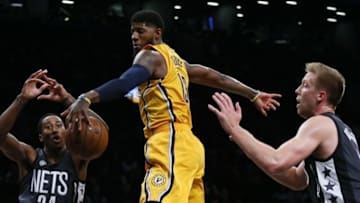Oct 28, 2016; Brooklyn, NY, USA; Indiana Pacers forward Paul George (13) battles for a rebound with Brooklyn Nets guard Rondae Hollis-Jefferson (24) and forward Justin Hamilton (41) during first half at Barclays Center. Mandatory Credit: Noah K. Murray-USA TODAY Sports