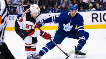 TORONTO, ON - JANUARY 14: Toronto Maple Leafs Defenceman Justin Holl (3) defends New Jersey Devils Right Wing Nikita Gusev (97) during the second period of the NHL regular season game between the New Jersey Devils and the Toronto Maple Leafs on January 14, 2019, at Scotiabank Arena in Toronto, ON, Canada. (Photo by Julian Avram/Icon Sportswire via Getty Images)