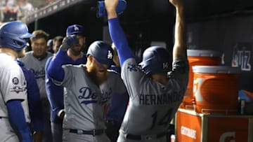 WASHINGTON, DC - OCTOBER 06: Kike Hernandez #14 and Justin Turner #10 of the Los Angeles Dodgers celebrate in the dug out during the sixth inning of Game 3 of the NLDS against the Washington Nationals at Nationals Park on October 06, 2019 in Washington, DC. (Photo by Rob Carr/Getty Images)