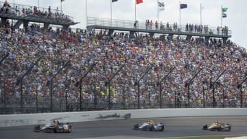 May 29, 2016; Indianapolis, IN, USA; IndyCar Series driver Alex Tagliani (35) , driver Alexander Rossi (98) and driver James Hinchcliffe (5) race in turn one during the 100th running of the Indianapolis 500 at Indianapolis Motor Speedway. Mandatory Credit: Michael Madrid-USA TODAY Sports