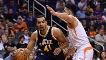 Apr 3, 2016; Phoenix, AZ, USA; Utah Jazz forward Trey Lyles (41) handles the ball in front of Phoenix Suns guard Devin Booker (1) in the second half at Talking Stick Resort Arena. The Utah Jazz won 101 - 86. Mandatory Credit: Jennifer Stewart-USA TODAY Sports