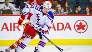 Nov 12, 2016; Calgary, Alberta, CAN; New York Rangers left wing Jimmy Vesey (26) controls the puck against the Calgary Flames during the second period at Scotiabank Saddledome. Mandatory Credit: Sergei Belski-USA TODAY Sports