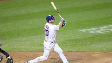 Sep 22, 2020; New York City, New York, USA; New York Mets first baseman Pete Alonso (20) follows through on a solo home run against the Tampa Bay Rays during the fourth inning at Citi Field. Mandatory Credit: Brad Penner-USA TODAY Sports