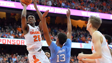 SYRACUSE, NY - FEBRUARY 21: Tyus Battle #25 of the Syracuse Orange shoots the ball around Cameron Johnson #13 of the North Carolina Tar Heels during the second half at the Carrier Dome on February 21, 2018 in Syracuse, New York. North Carolina defeated Syracuse 78-74. (Photo by Rich Barnes/Getty Images)