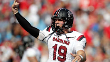 CHARLOTTE, NC - SEPTEMBER 02: Jake Bentley #19 of the South Carolina Gamecocks reacts after throwing a touchdown against the North Carolina State Wolfpack during their game at Bank of America Stadium on September 2, 2017 in Charlotte, North Carolina. (Photo by Streeter Lecka/Getty Images)