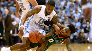 CHAPEL HILL, NC - FEBRUARY 09: Chris Lykes #0 of the Miami Hurricanes fouls Seventh Woods #0 of the North Carolina Tar Heels while trying to steal the ball in the first half at Dean Smith Center on February 9, 2019 in Chapel Hill, North Carolina. (Photo by Lance King/Getty Images)