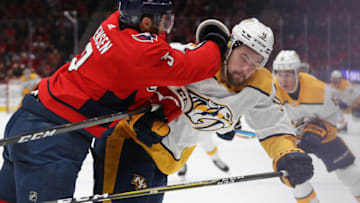 Nick Jensen #3 of the Washington Capitals checks Filip Forsberg #9 of the Nashville Predators during the third period at Capital One Arena on January 29, 2020 in Washington, DC. (Photo by Patrick Smith/Getty Images)
